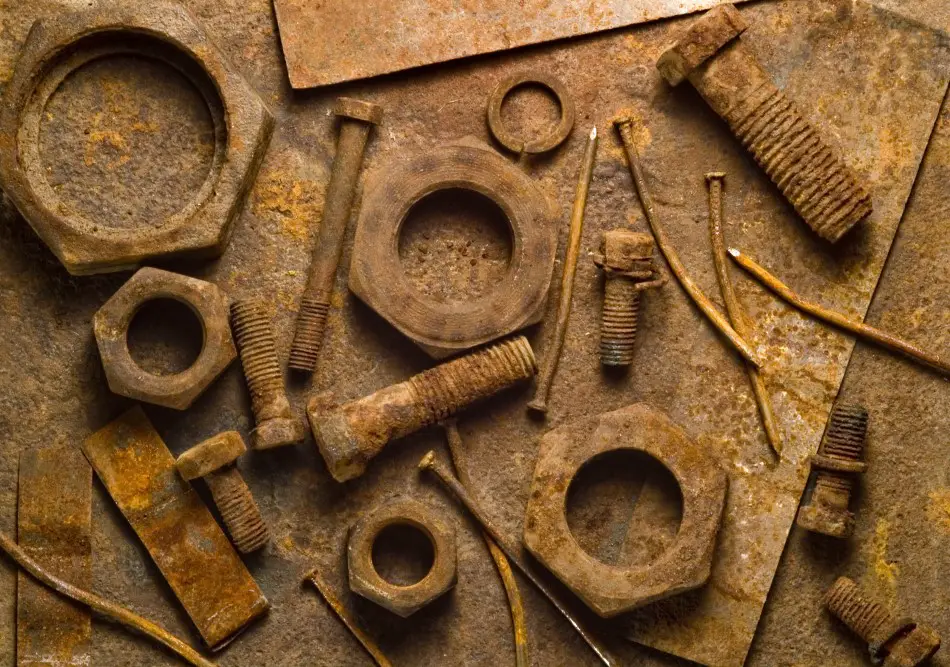 Photo of rusty tools on a rusty table backdrop