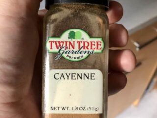 Photo of dried Cayenne pepper in a glass rectangular container