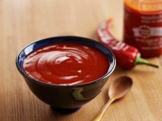 Bowl of red Sriracha hot sauce